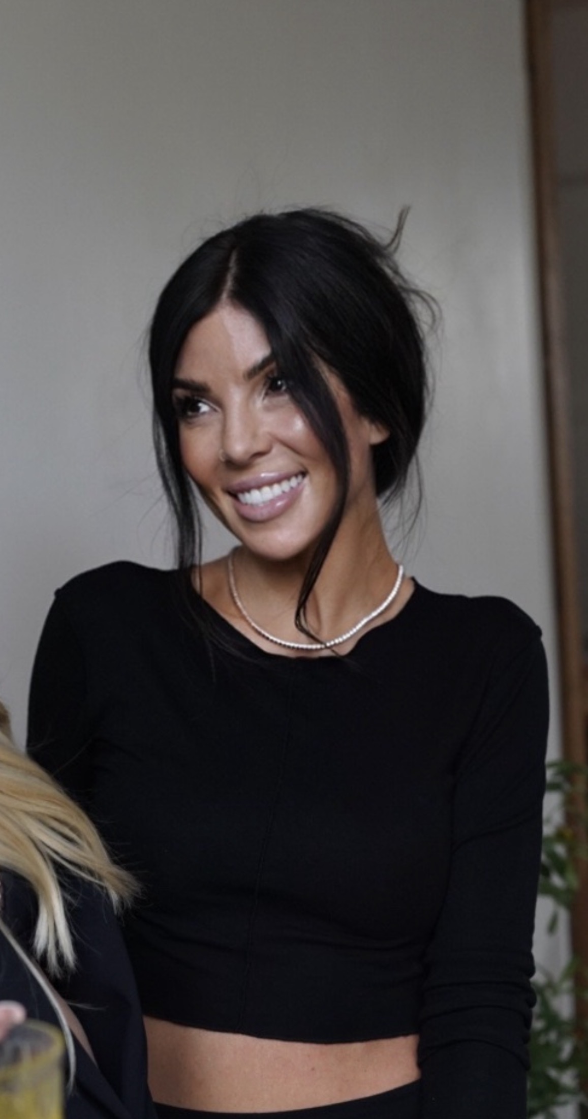 Alyssa smiling in her studio